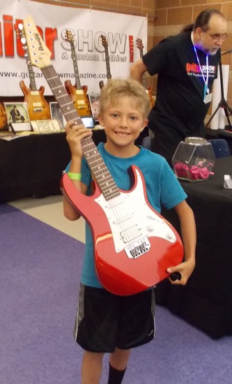 Spencer with red guitar